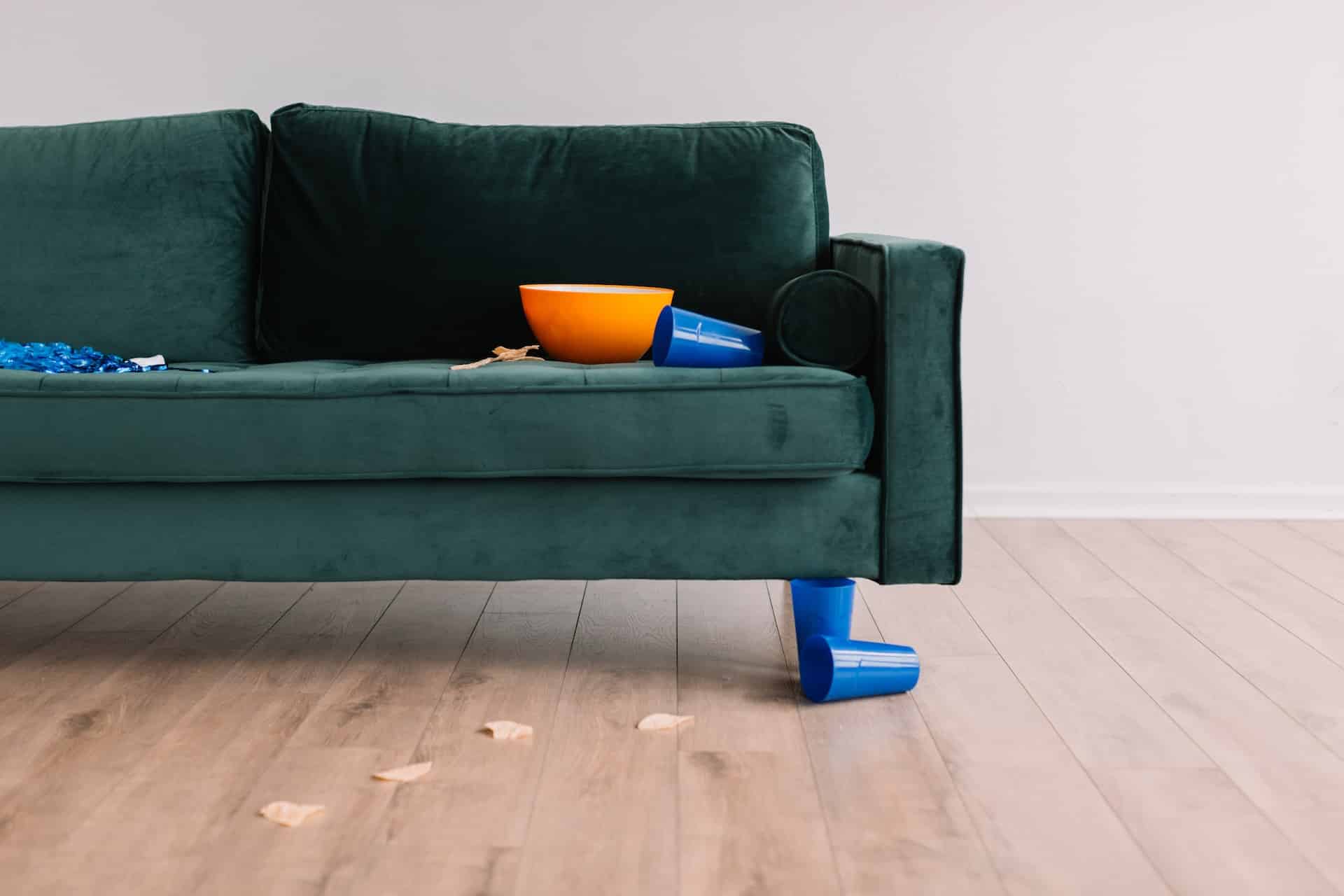sofa in need of cleaning after a house party