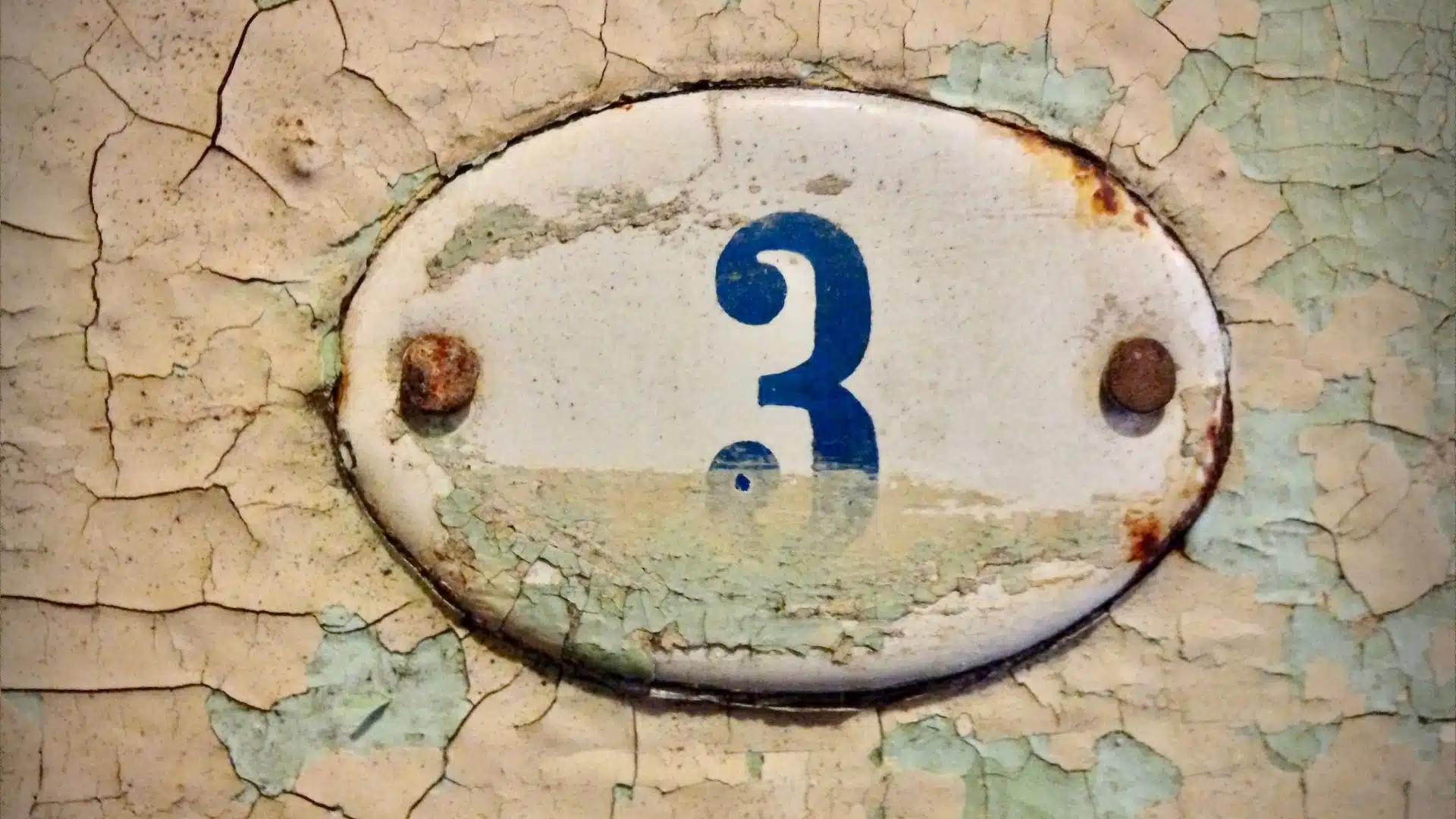 corroded house number