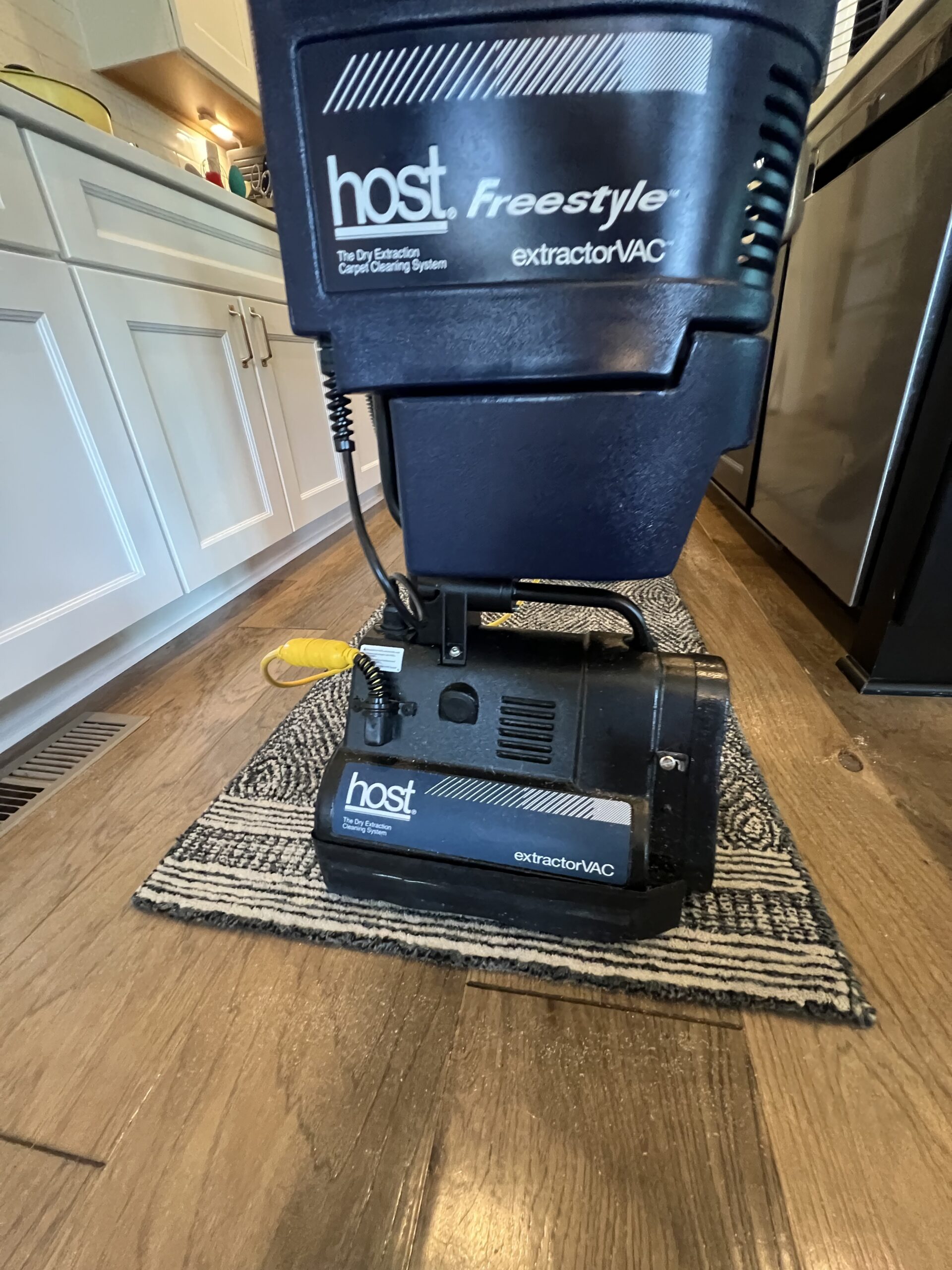 CottageCare HOST dry extraction carpet cleaning machine on a wood floor